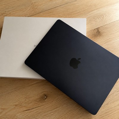 Laptop — light wood — the same shot after the background swap, the subject unchanged